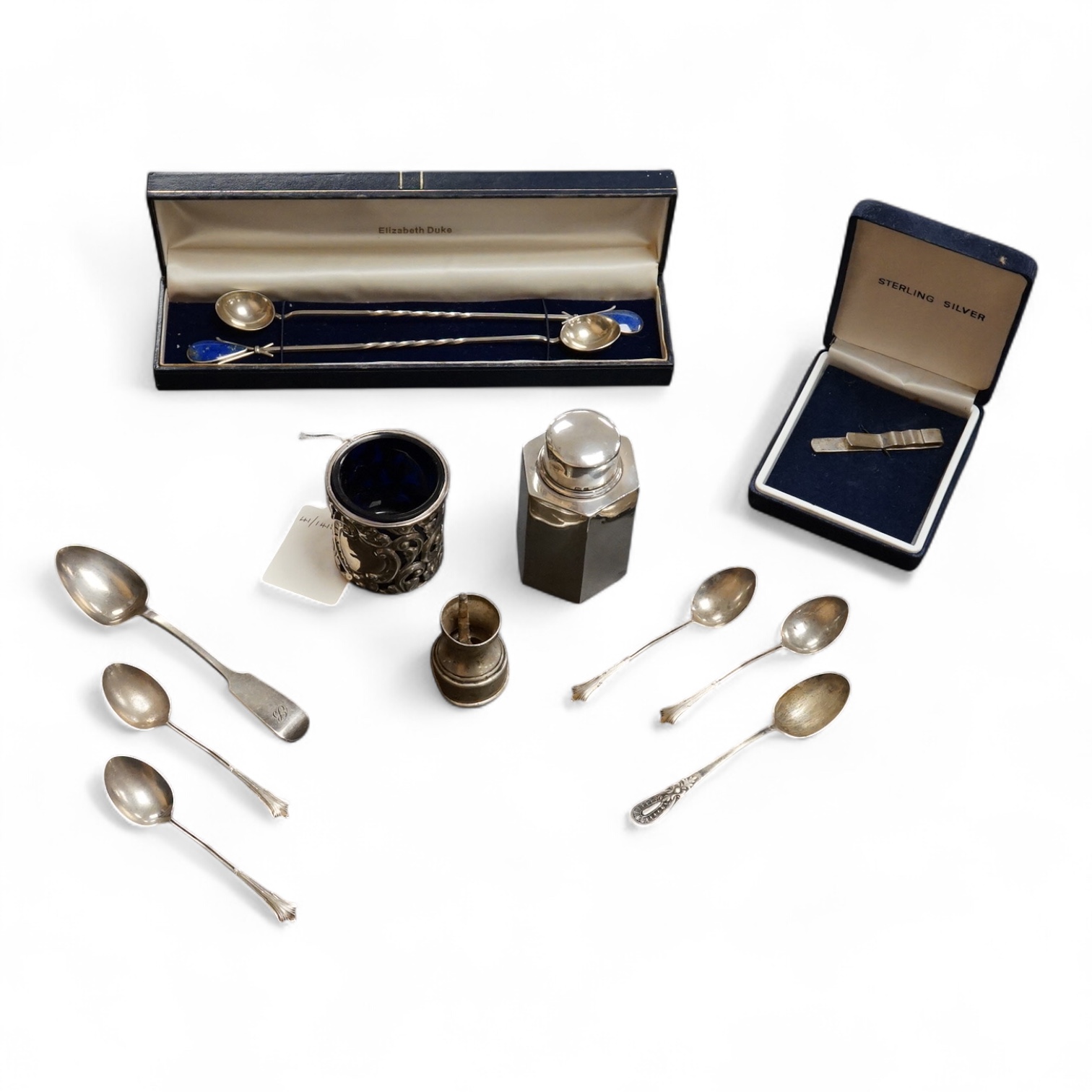 A small group of collectable silver including a pair of modern 925 and lapis lazuli set cocktail stirring spoons, an Edwardian small hexagonal tea caddy, a late Victorian pierced silver salt with blue glass liner and eig